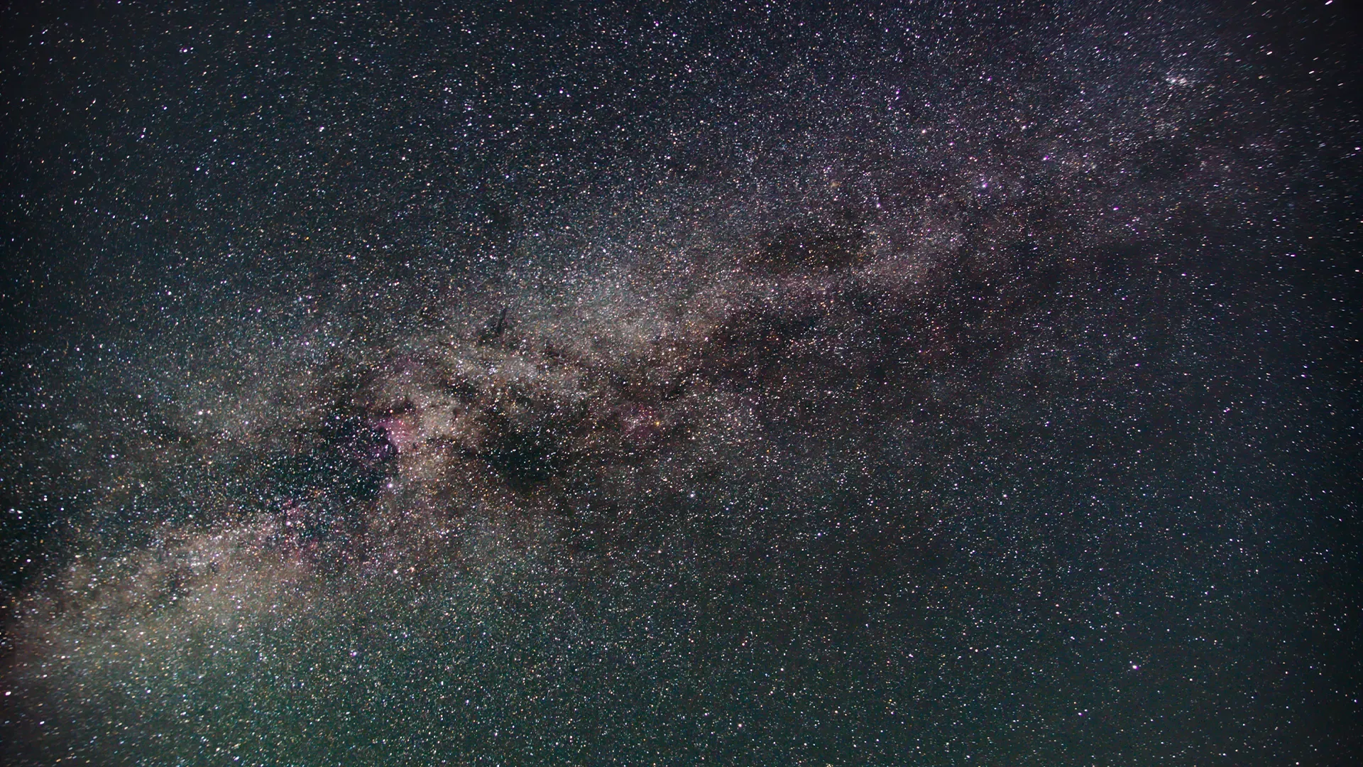 The Milky Way over a dark mountain
