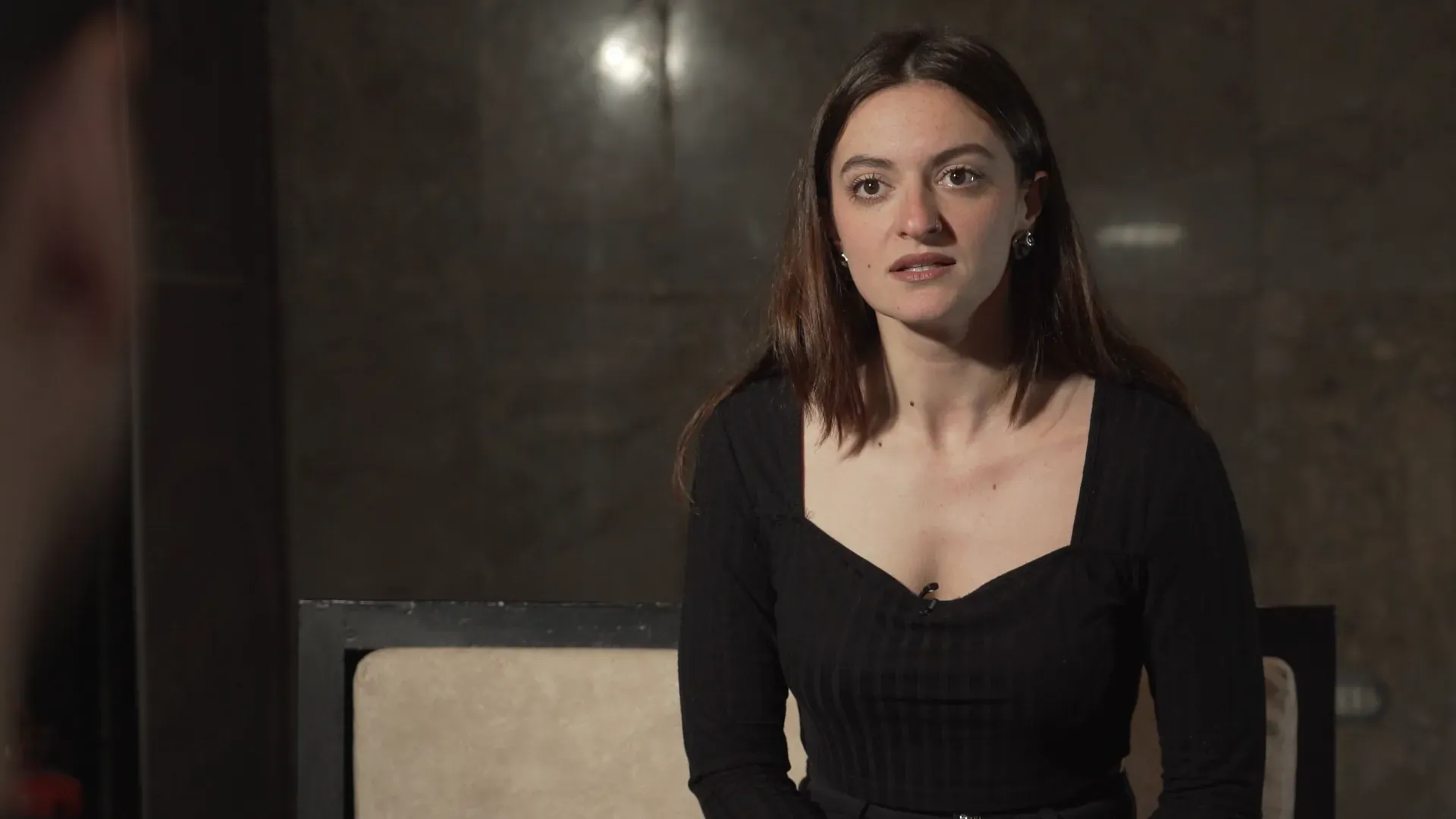 A young woman in an interview chair