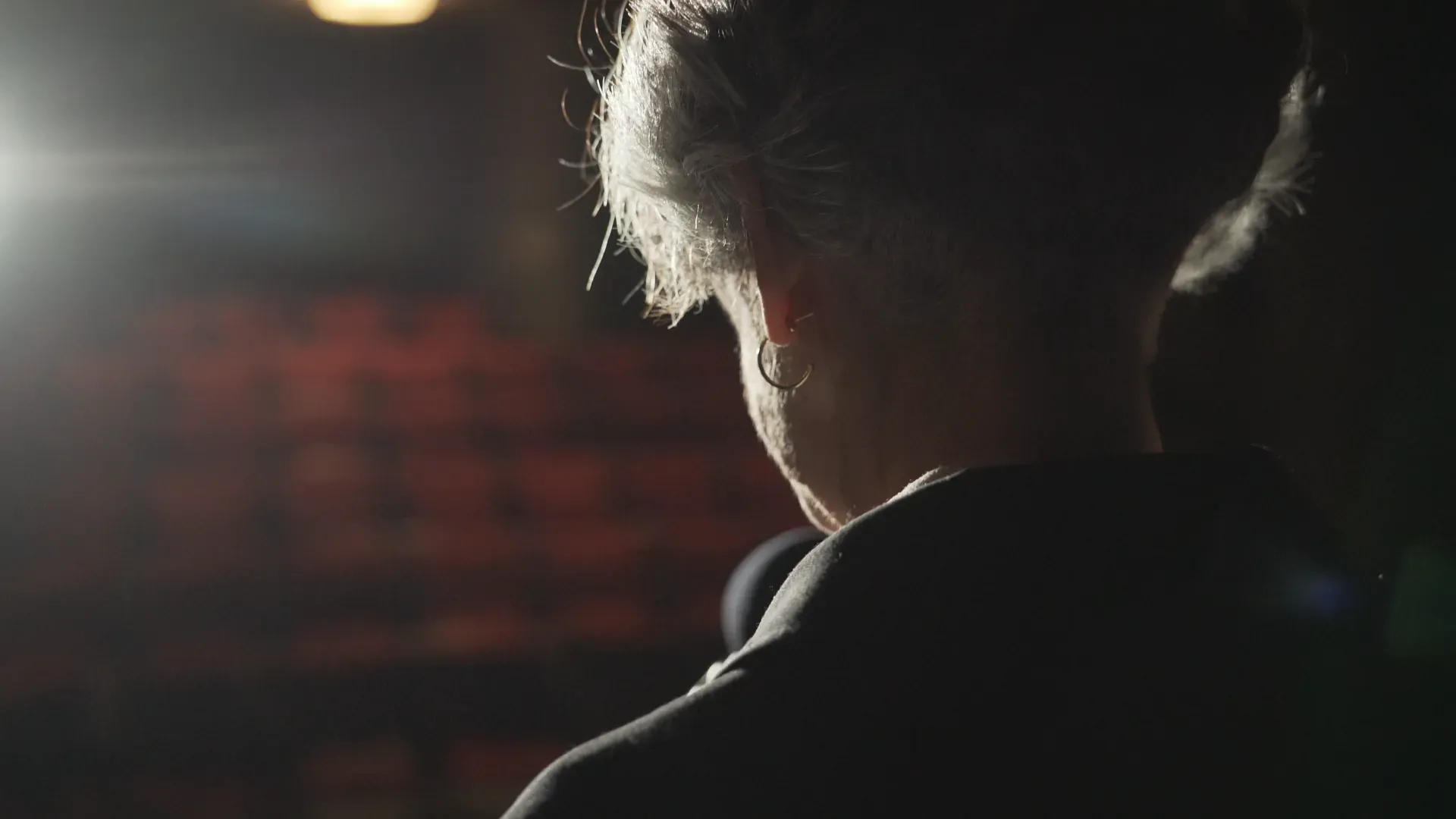 Silhouette against theatre lights