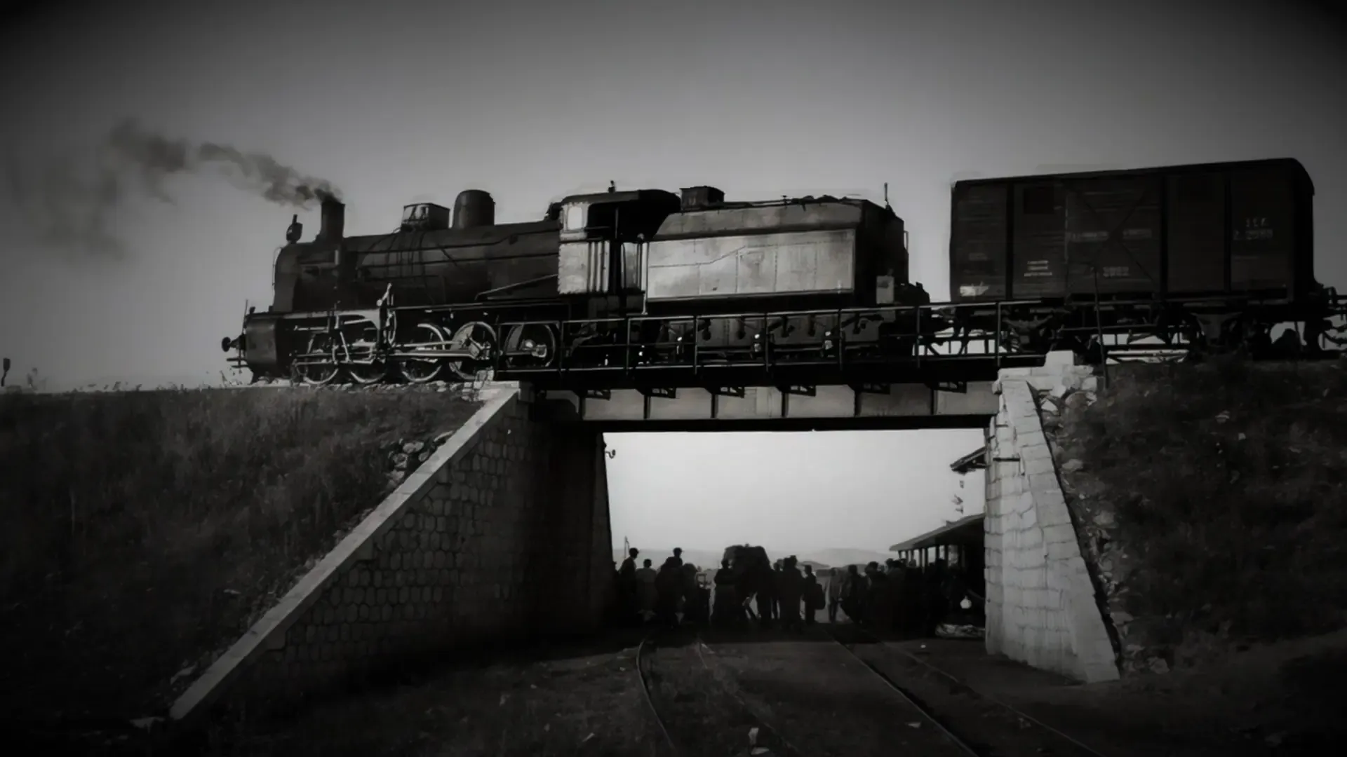 A steam train crossing a bridge